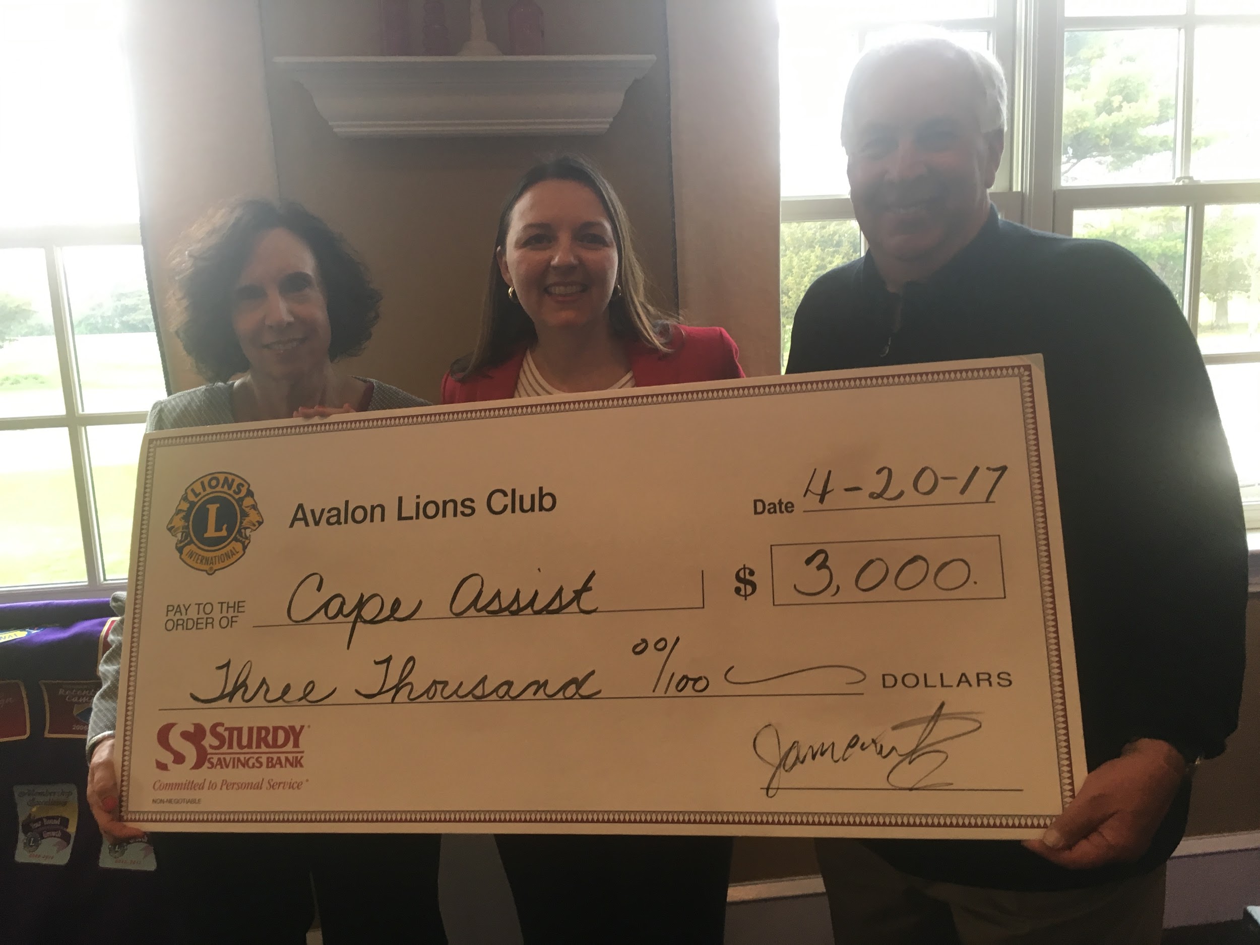 Avalon Lions present a donation to Cape Assist. Pictured from left are Lions member Marianne Snyder