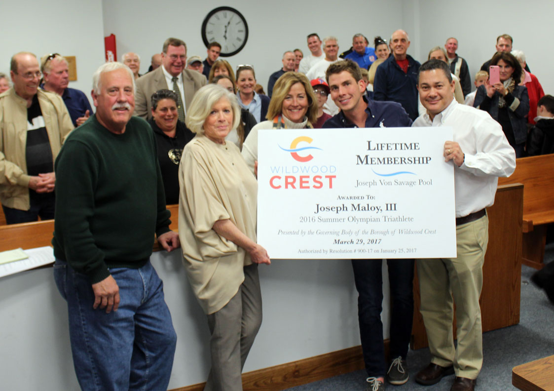 U.S. Olympic triathlete Joe Maloy (second from right) was honored by the Borough of Wildwood Crest at its March 29 Board of Commissioners meeting. The borough presented Maloy with a complimentary lifetime membership to the Joseph Von Savage Memorial Pool. Pictured with Maloy are (from left): Mayor Carl Groon; Commissioner Joyce Gould; Maloy's mother