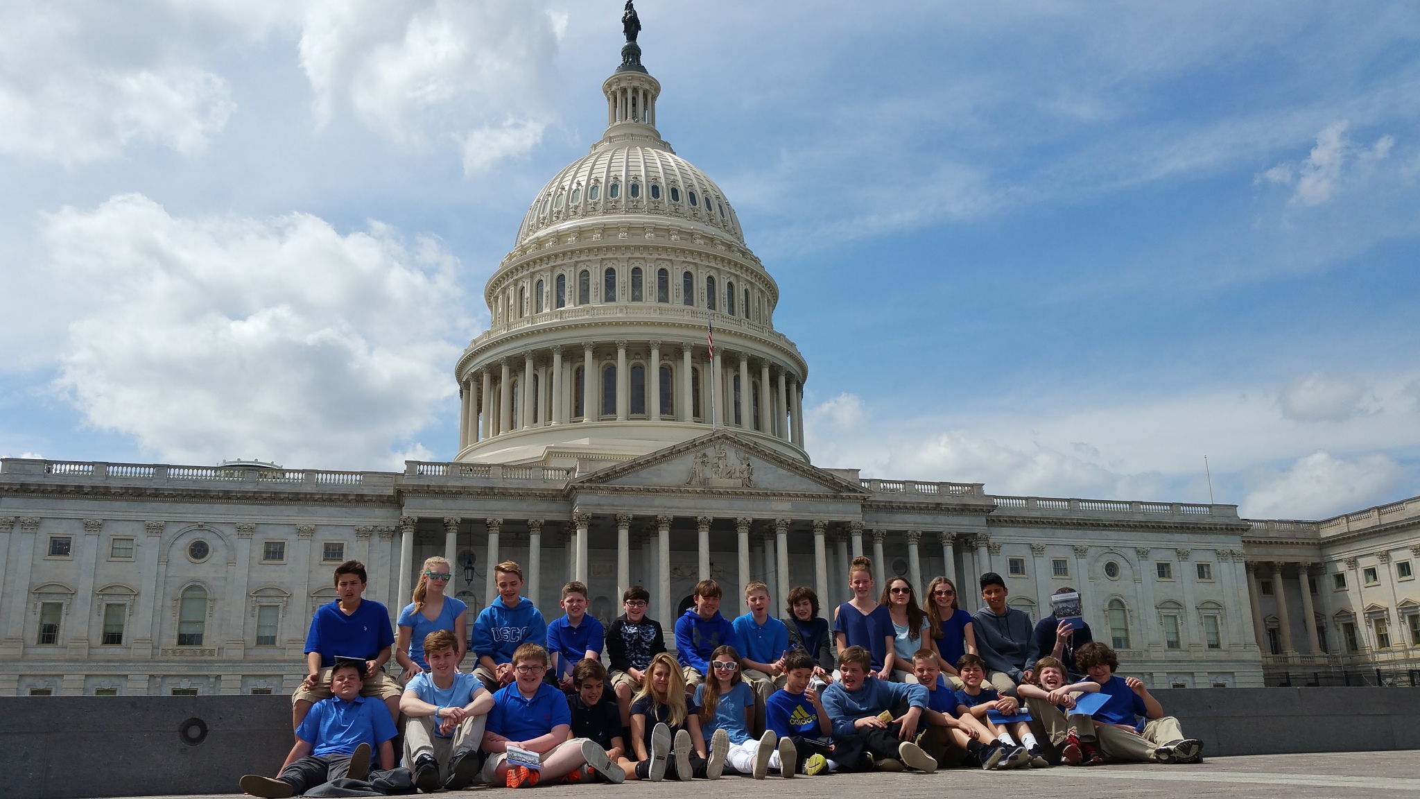 7th grade in front of Capitol - three groups posing in front of US Capitol building after tour.