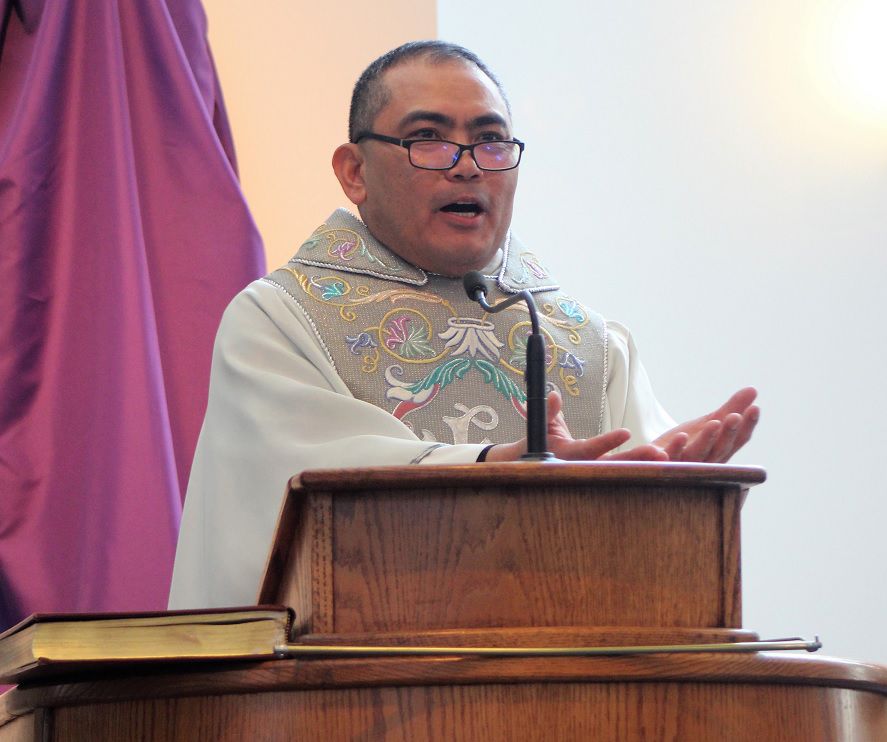 Rev. Cosme De Le Pena celebrates his 25th year as an ordained priest during a special Mass April 2 at Our Lady of the Angels Church in Court House.