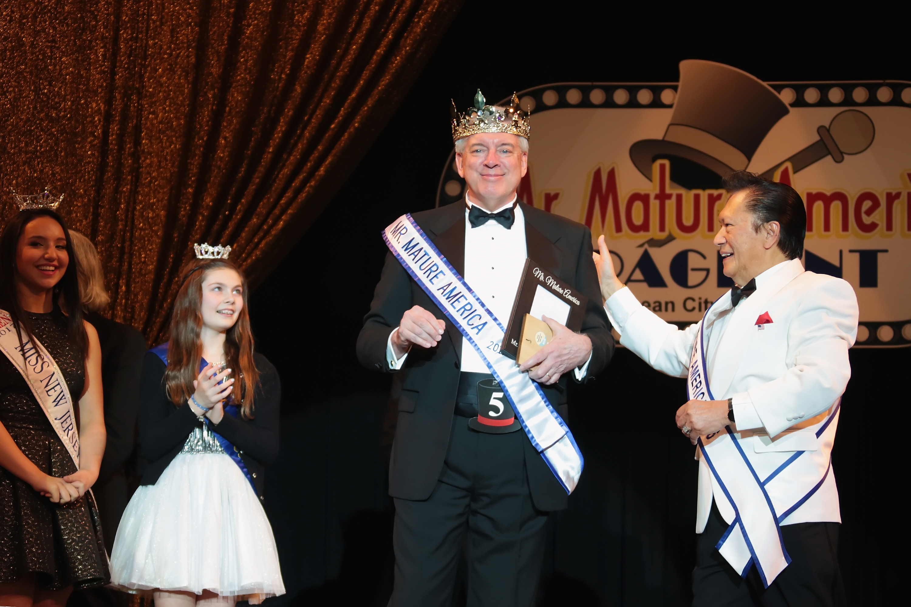 Mr. Mature America 2017 Matthew Allen crowned by reigning Mr. Mature Rene Sese.