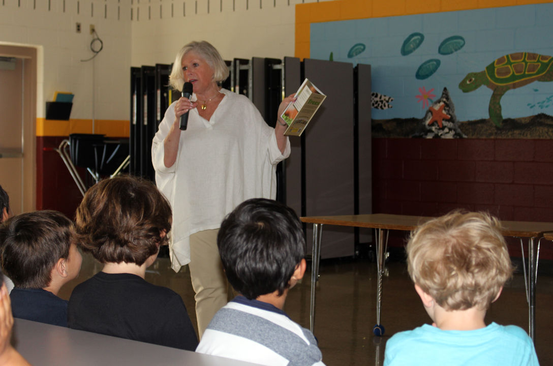 Borough of Wildwood Crest Commissioner and Deputy Mayor Joyce Gould reads a story to children about different types of trees and how they grow to children in grades K-5 at Crest Memorial School as part of the borough’s Arbor Day program at the school on Friday