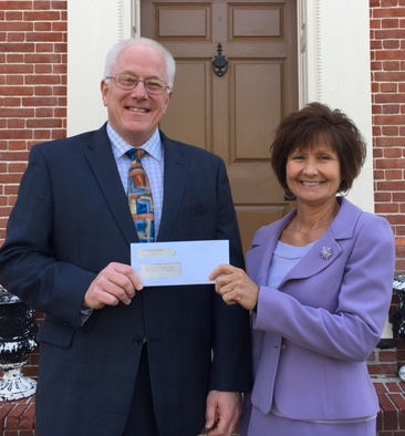 Sturdy Savings Bank’s Dennisville Branch Manager Chris Hayes presents Executive Director of The Arc of Cape May County Patricia Merk with Sturdy Savings Bank’s annual corporate donation.