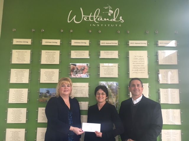 Sturdy Savings Bank’s Stone Harbor Branch Manager Kathleen Makowski (left) and Sturdy Financial Services’ Financial Adviser Christopher Shoemaker (right) present The Wetlands’ Institute Executive Director Lenore Tedesco