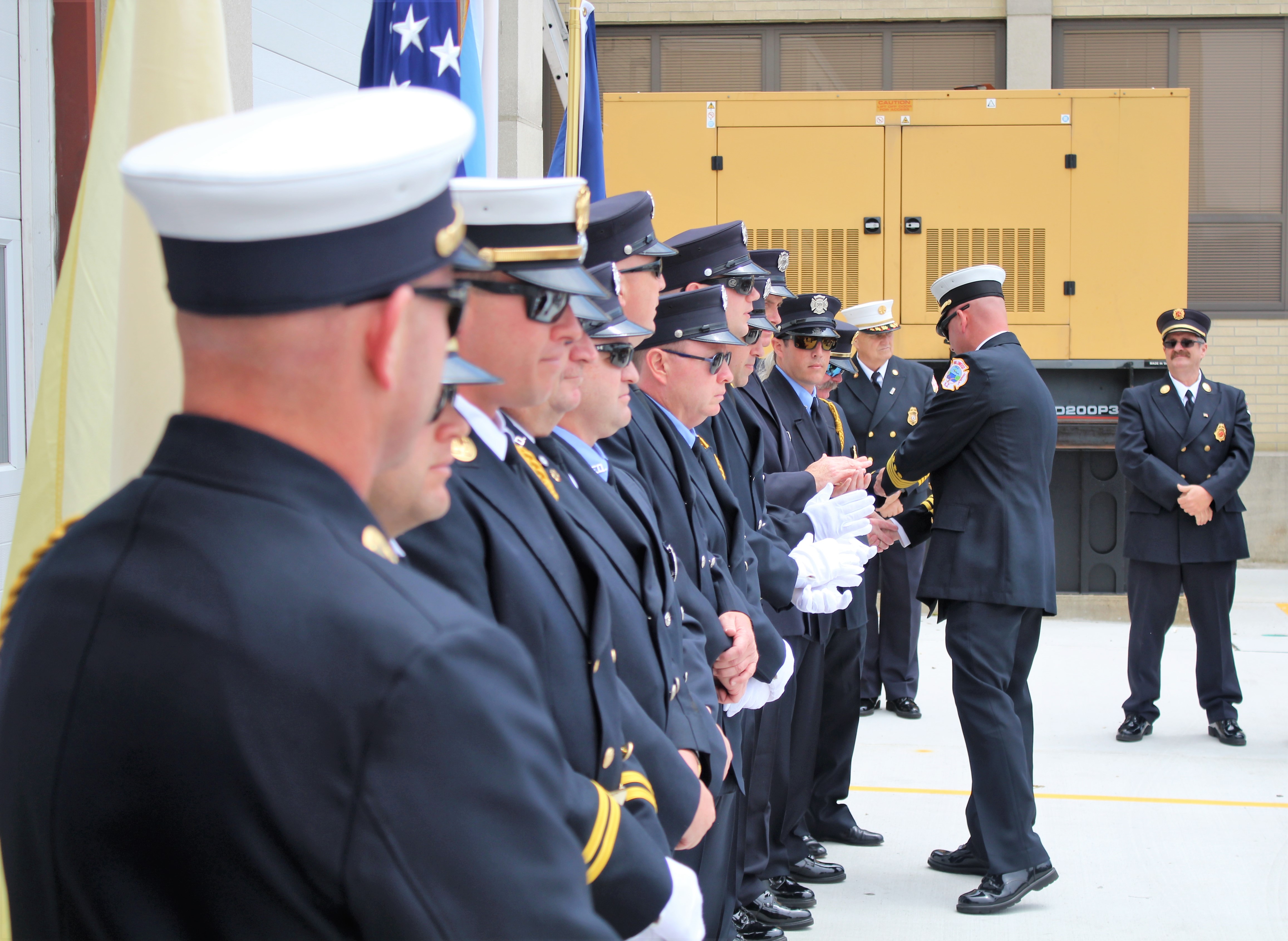 Deputy Fire Chief Ernie Troiano III presents medals and congratulates Wildwood firefighters during the first Medal Day ceremony May 20.