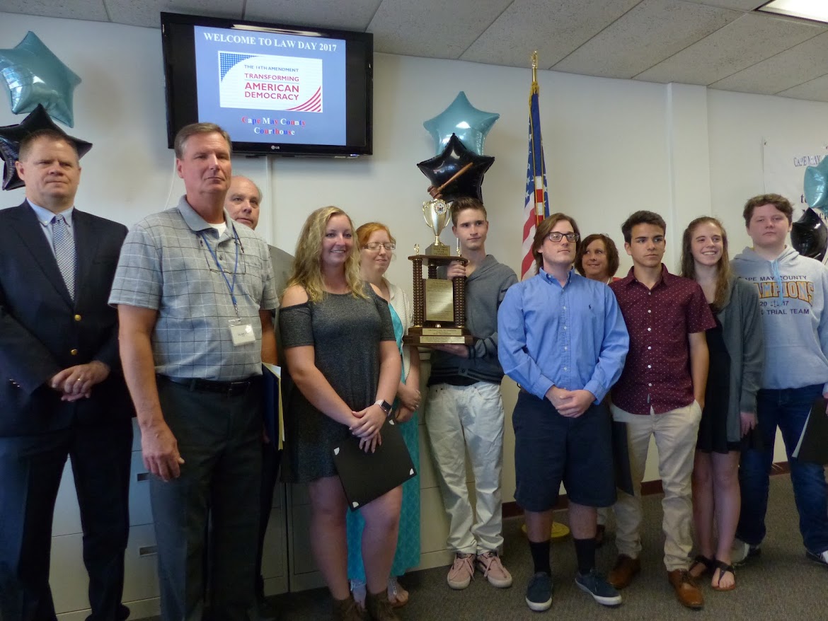 Mock Trial Team from Lower Cape May Regional High School surrounds the trophy they worked hard to win in January competitions.