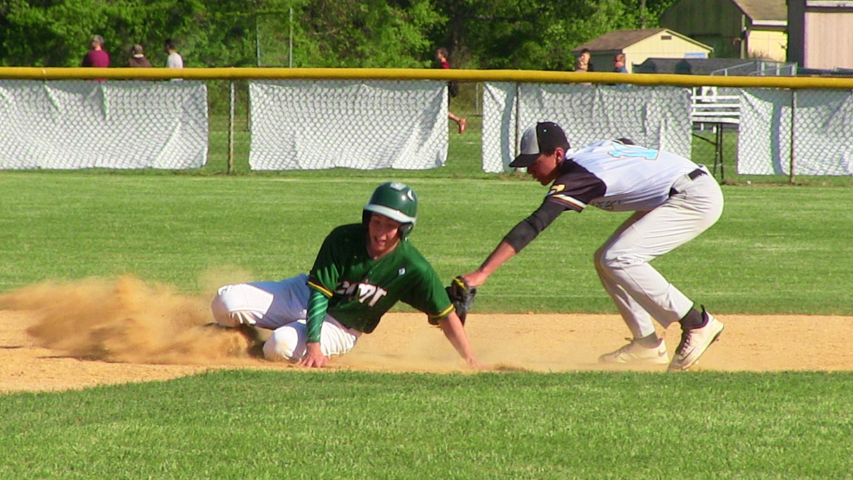 Cape May Tech’s Zach Powers slides past Lower Cape May’s Brennan Ray into second base in a rivalry baseball game earlier this season in Erma.