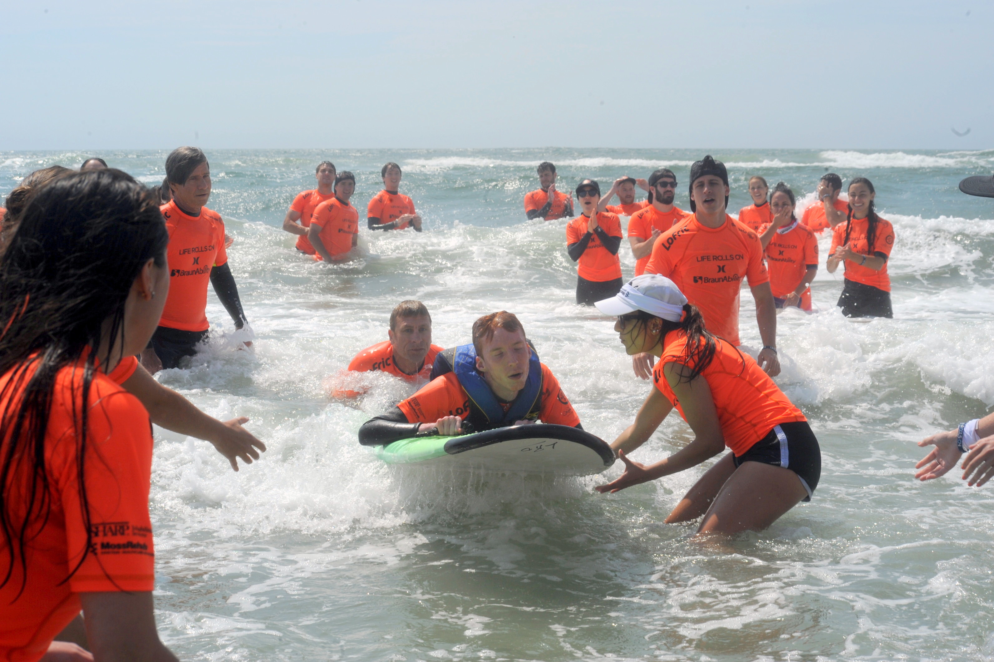 Life Rolls On volunteers assist surfer in Wildwood Crest during the annual event June 18.