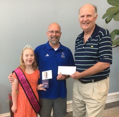 Sturdy Savings Bank President Gerald R. Reeves (right) presents a sponsorship check to New Jersey Miss Amazing Junior Teen 2017 Chloe Byrne and her Father Geoffrey Byrne.