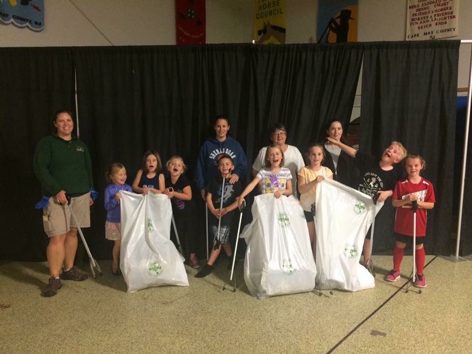 The Clover Kids 4-H Club participated in a Fairgrounds clean up. Pictured from left are Assistant Club Leader Christi Gotwals with members Raelyn