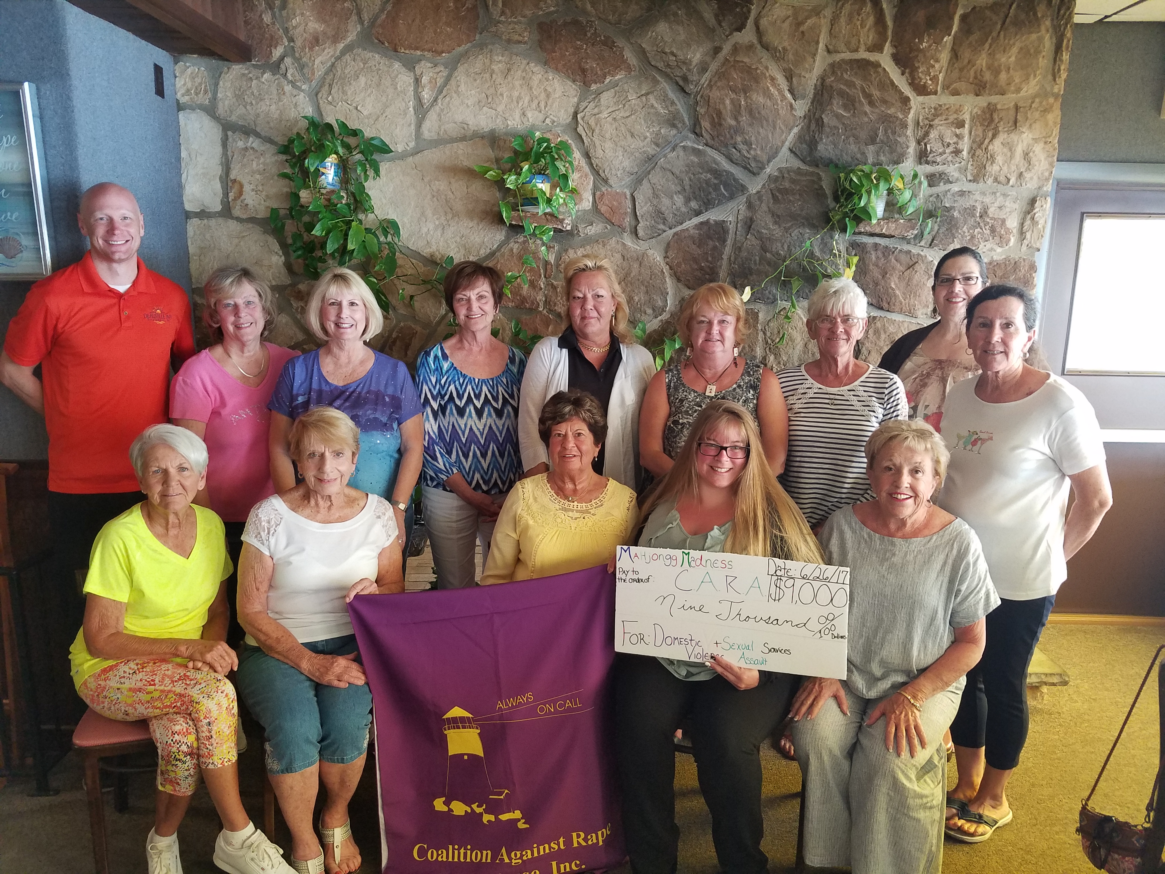 “Mahjongg Angels” presenting CARA Staff with their donation.1st row left -right:  Peg McDermott