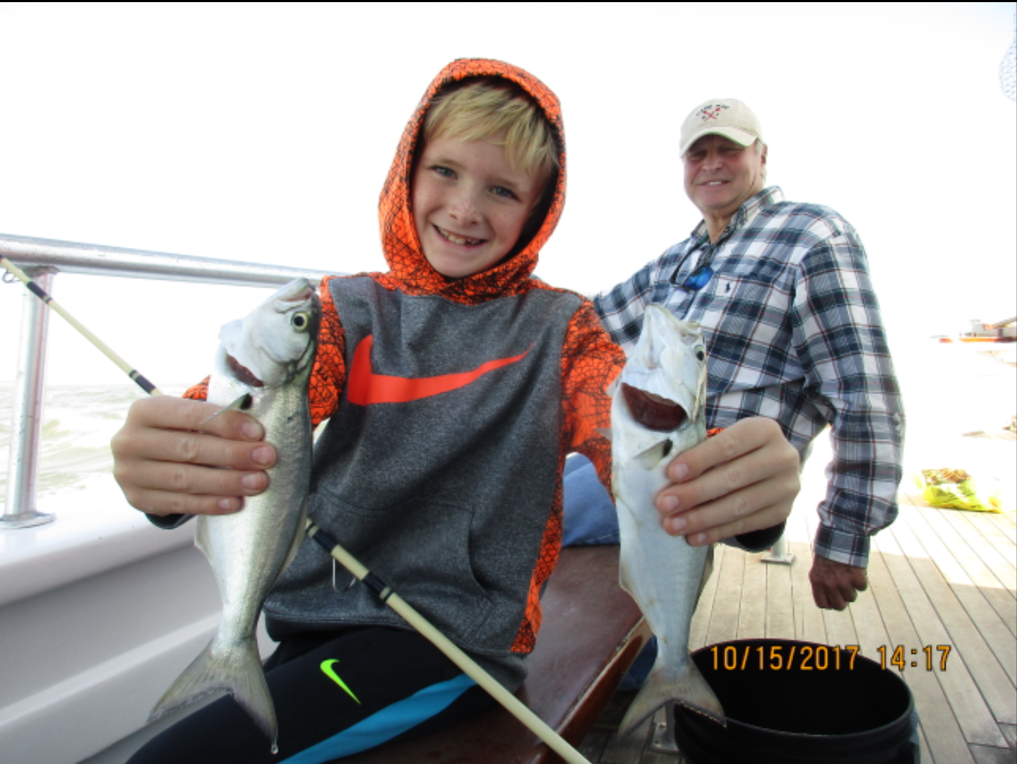 A young angler and his first deep-sea fish. 