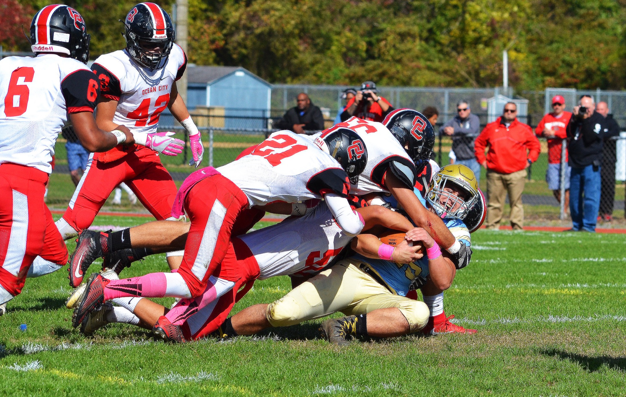 The Ocean City defense tackles Lower Cape May's Tony Kapurelos in Oct. 28's game in Erma.