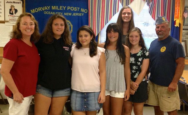 Girl Scout Troop 41014 Leader Beth Martin (left) poses with Silver Award members Anna Wisham