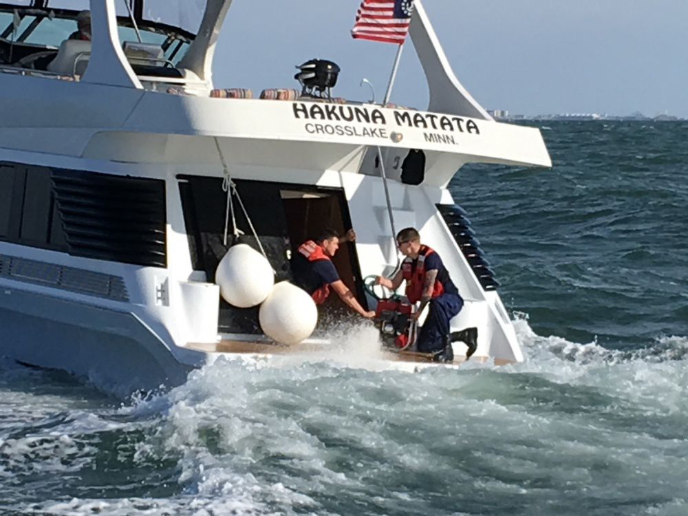 A Coast Guard 45-foot motor lifeboat crew from Station Cape May assists the crew of a recreational vessel six miles east of Cape May