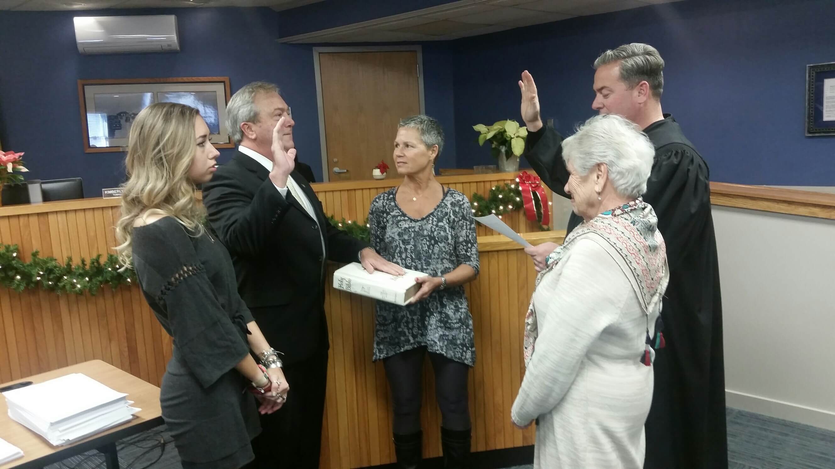 Judge Michael Donohue swears in Tim Donohue with wife Carole