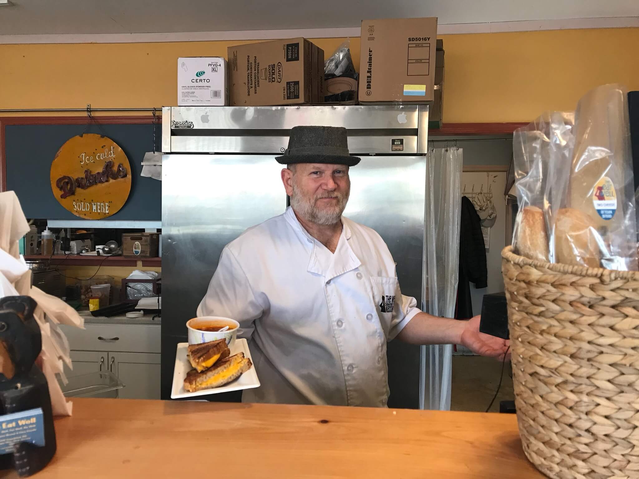 Drew Gandley offers a grilled cheese sandwich and a cup of tomato basil soup to anyone who comes to his restaurant