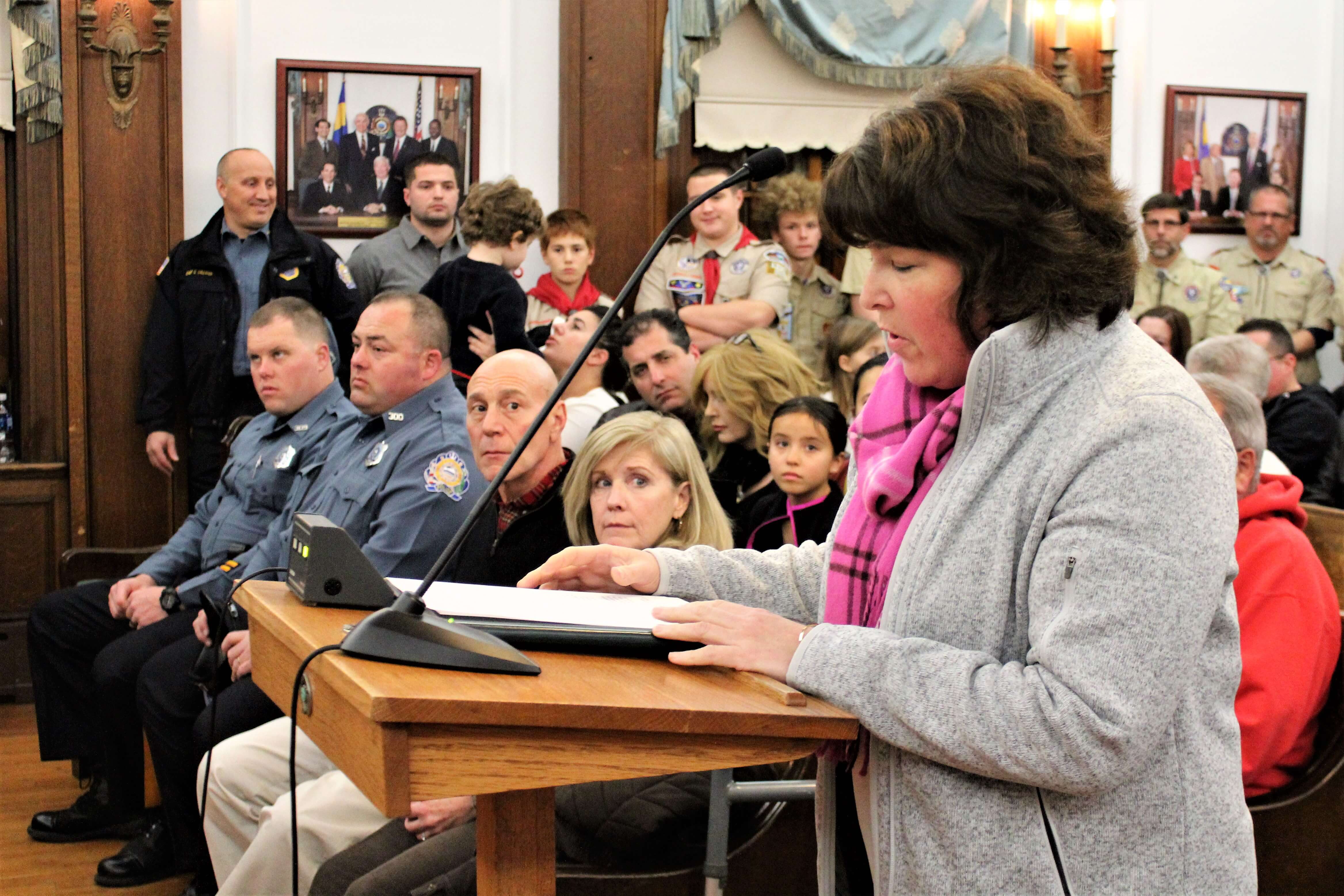 Carolyn Logan described the city’s cutting of brush and trees in her neighborhood as a scalping