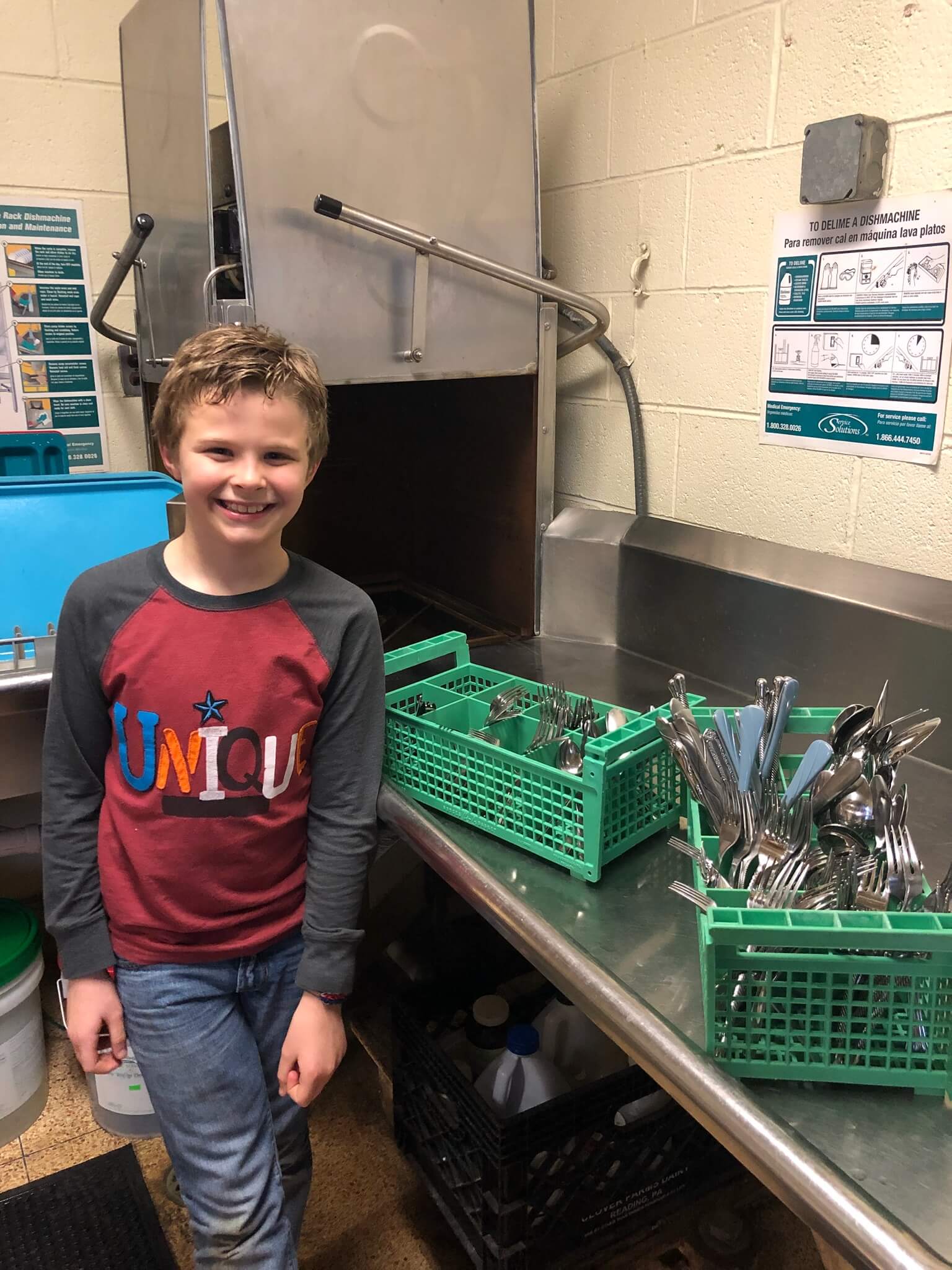 Fourth-grader Theo Kistler with silverware donated over a few days after he started his campaign to reduce plasticware at the Cape May City Elementary School.