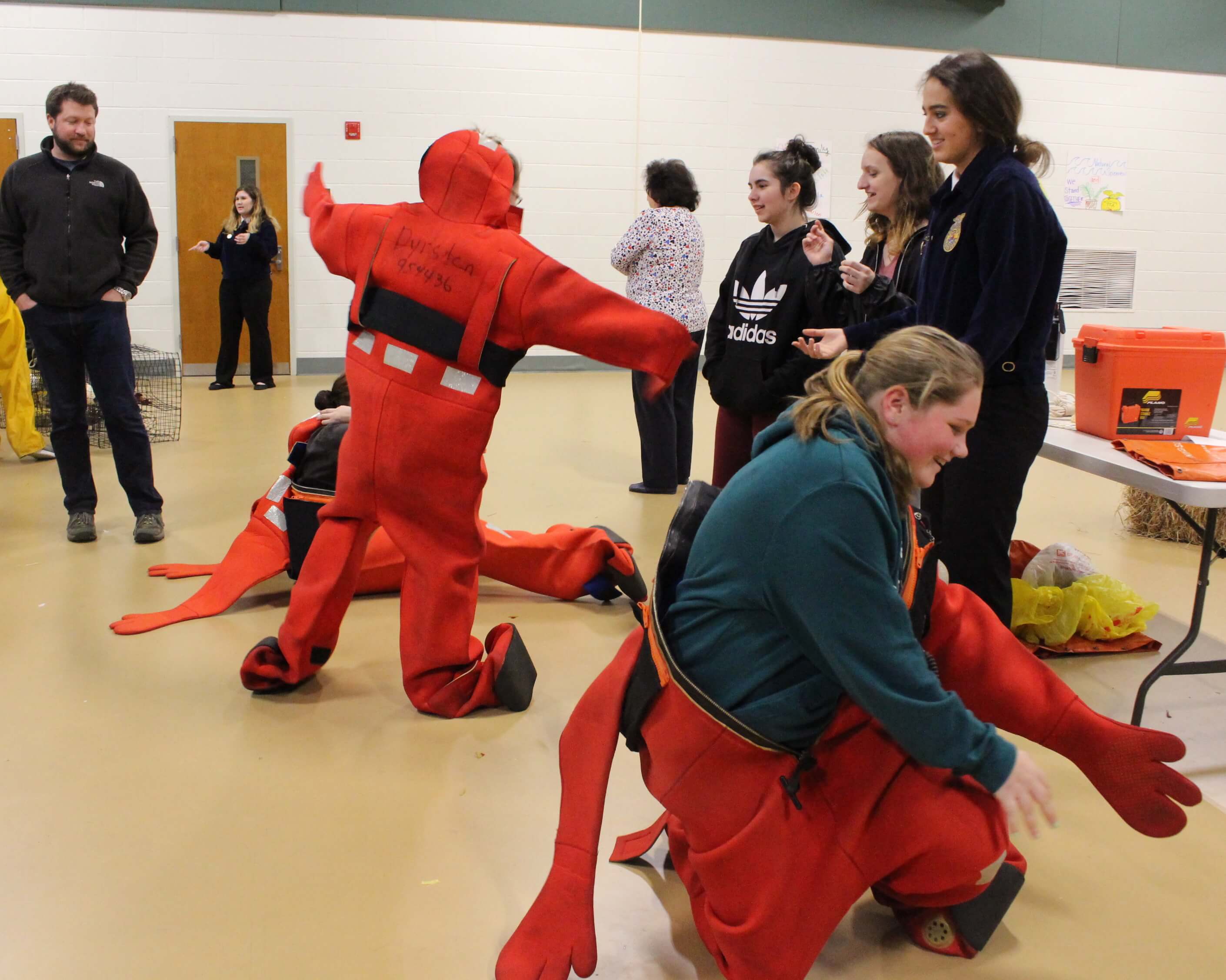 Freshmen race to get into insulated waders in less than a minute at Cape May County Technical High School’s first Agricultural Awareness Day Feb. 23.