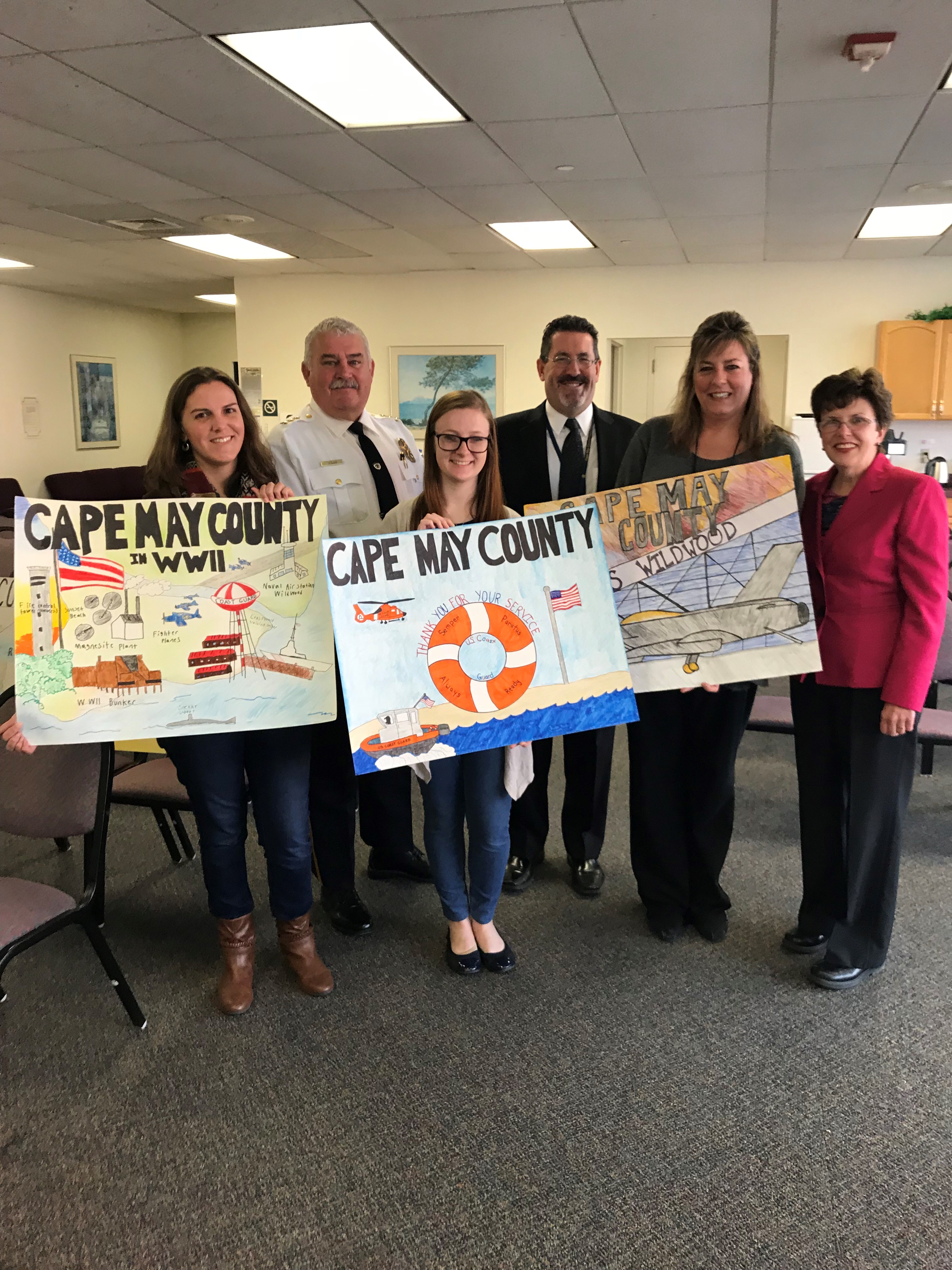 My County Poster Contest judges Mary Eckland (left) and Olivia Gorecke (center) of the Cape May County Library and Deborah Greene (2nd from right) of the Cape May County Clerk’s Office with Sheriff Robert Nolan (2nd from left)