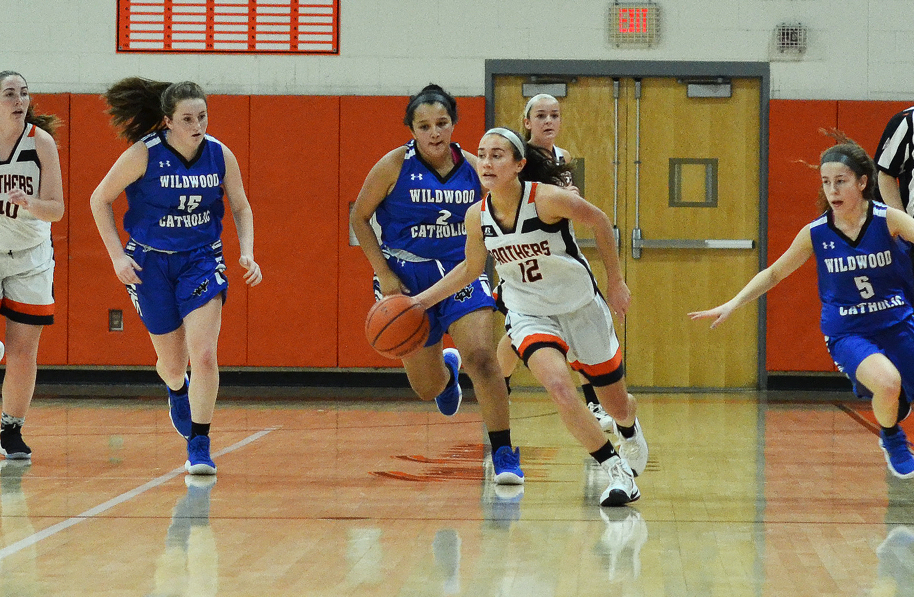 Middle Township's Kate Herlihy (12) dribbles past Wildwood Catholic defenders in a game earlier this season.