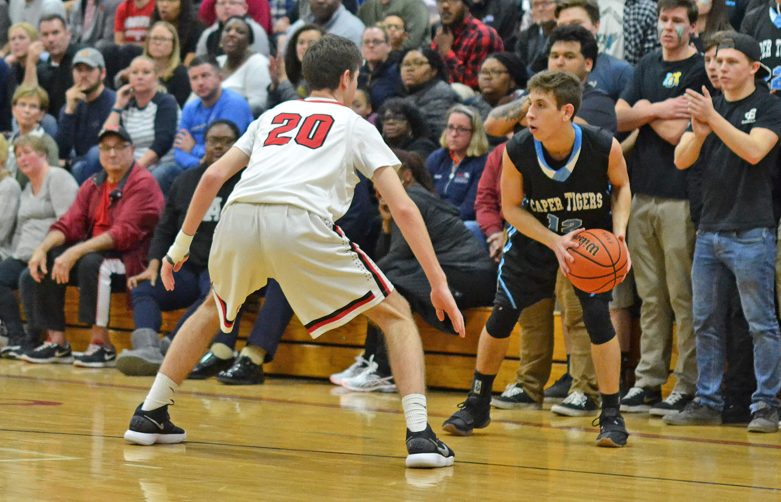 Lower Cape May’s Pat Holden (12) looks to pass the ball in the South Jersey Group II final game against Haddonfield on March 5. Holden led the Caper Tigers with 19 points.