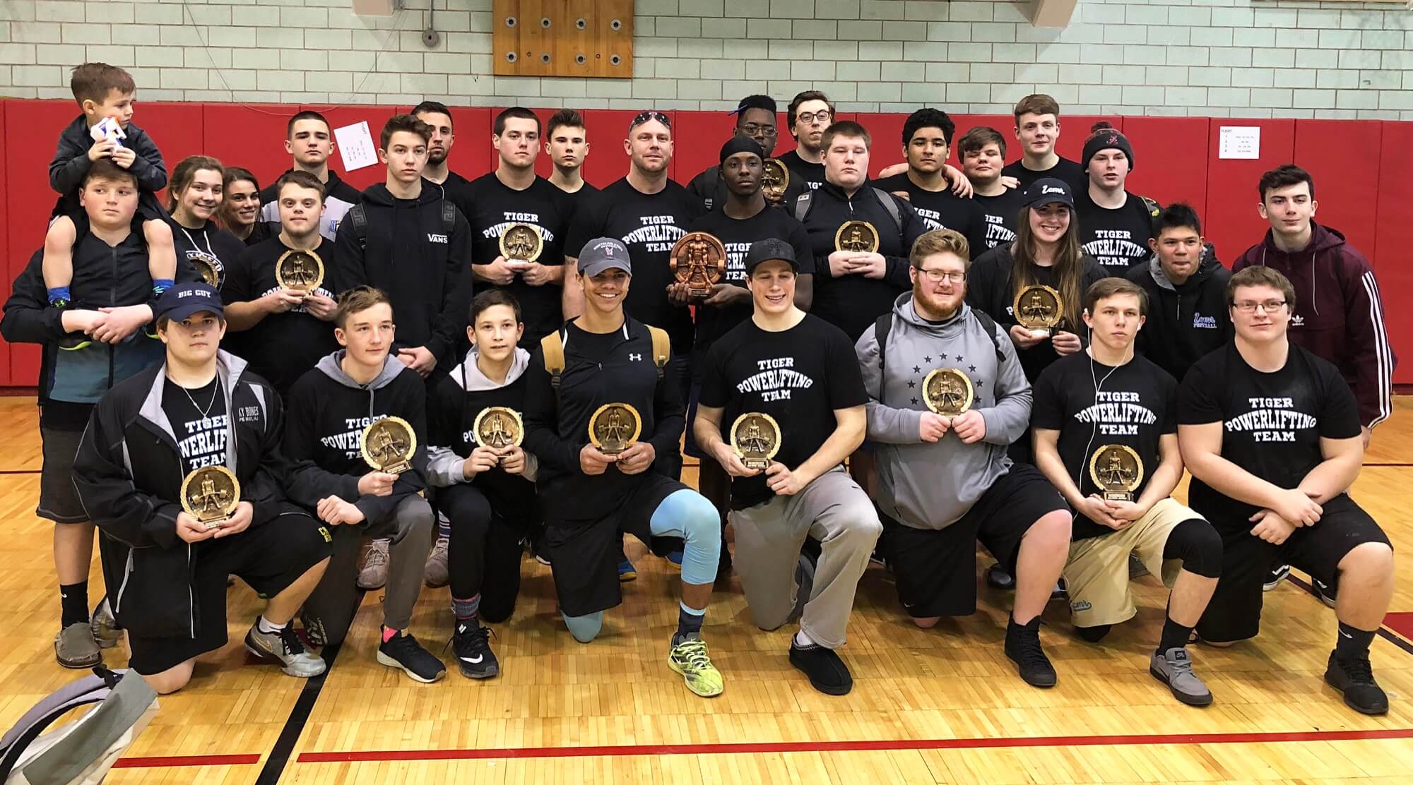 The Lower Cape May Regional High School powerlifting team poses with their finisher plaques at St. Joseph High School on March 10.