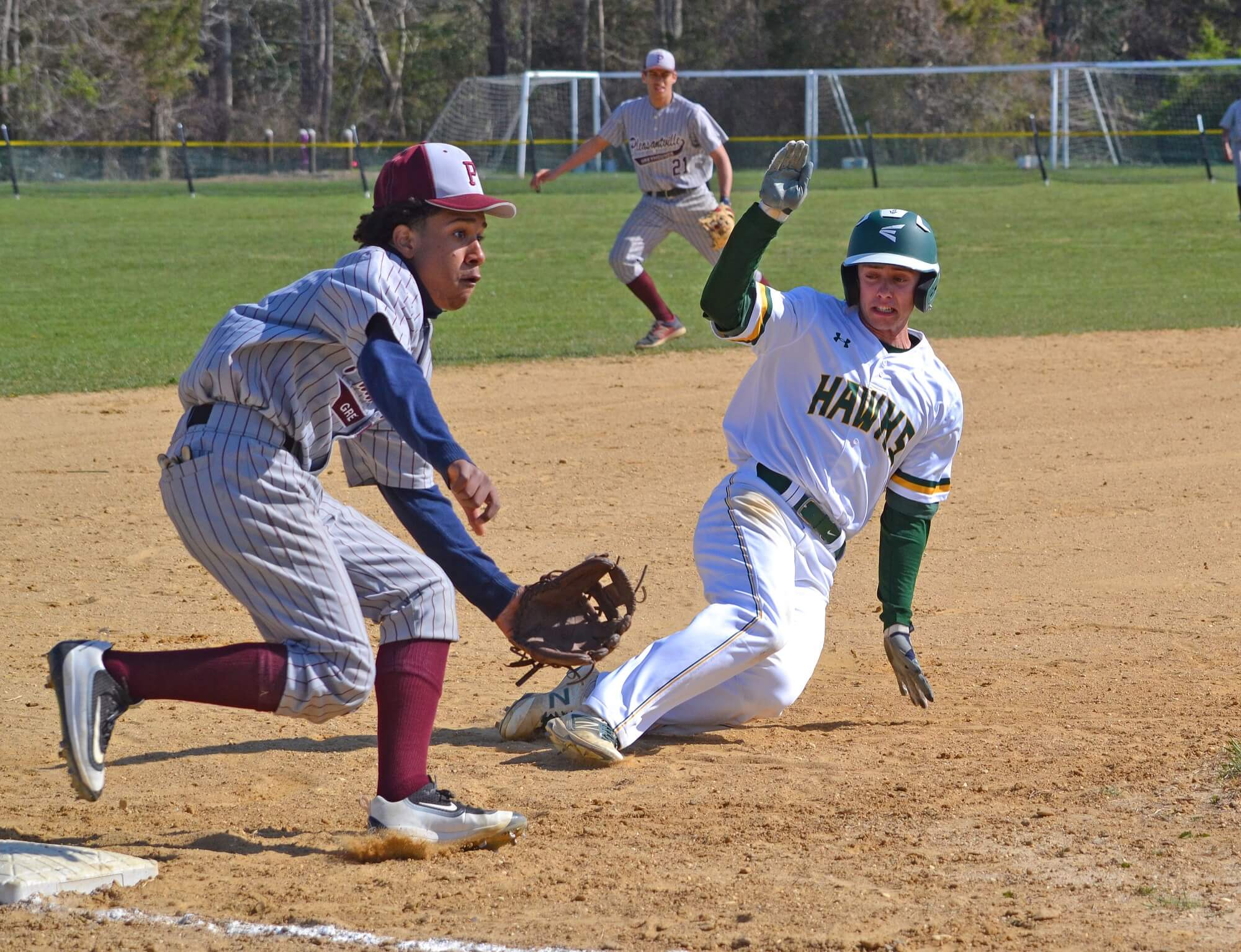 Cape May Tech’s Jack O’Donnell slides into third base in the team’s home game on April 20. The Hawks defeated visiting Pleasantville 13-2 in Crest Haven.