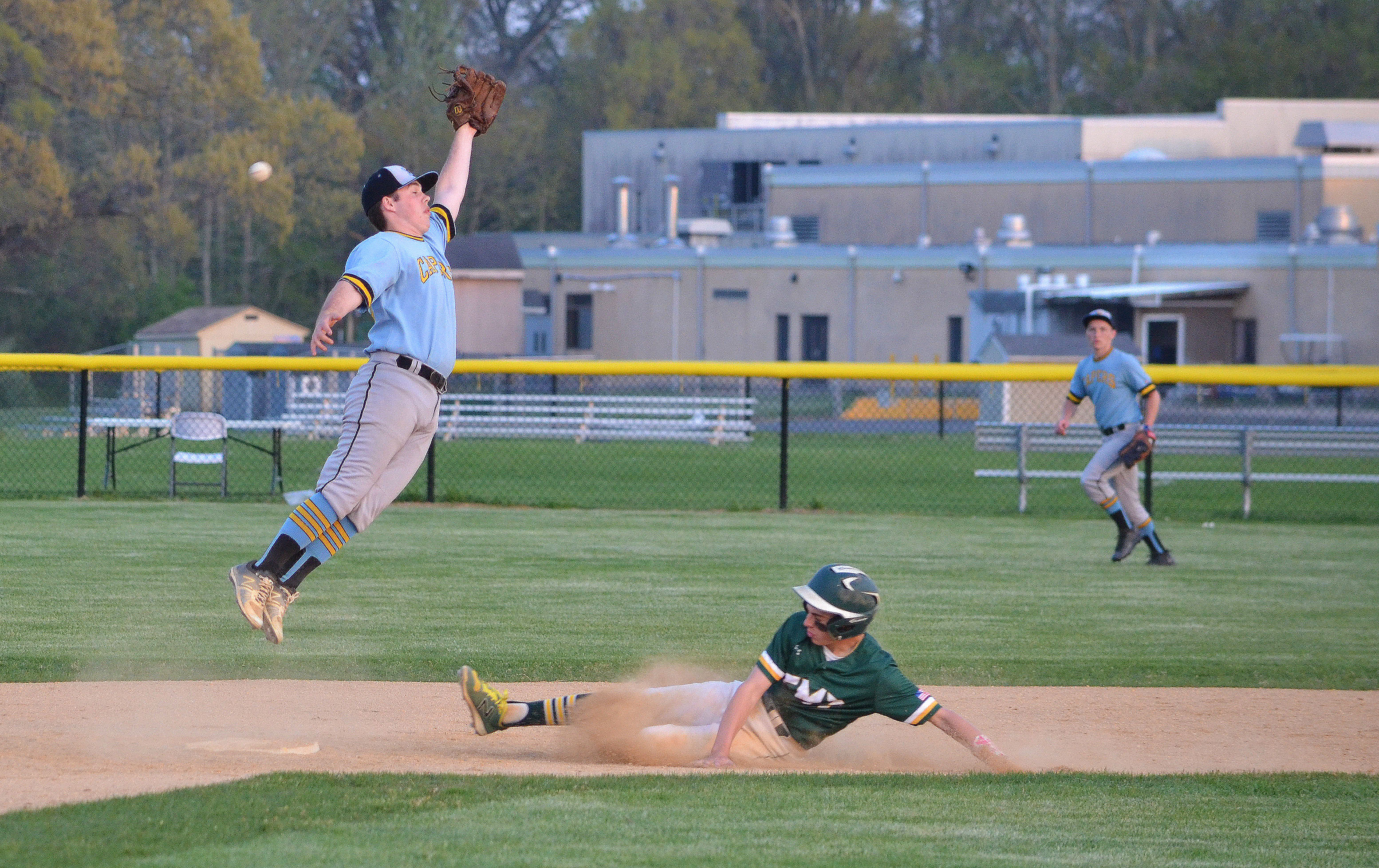 Cape May Tech’s Cooper Gerhing slides into second base in May 4’s baseball game at Lower Cape May. Gerhing scored three runs in the Hawks’ 9-4 win.