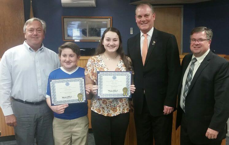 Sawyer Lomax and Sophia Lomax display certificates of appreciation for their video of the Ockie Wisting Recreation Complex from Middle Township Committee presented May 7. With them is