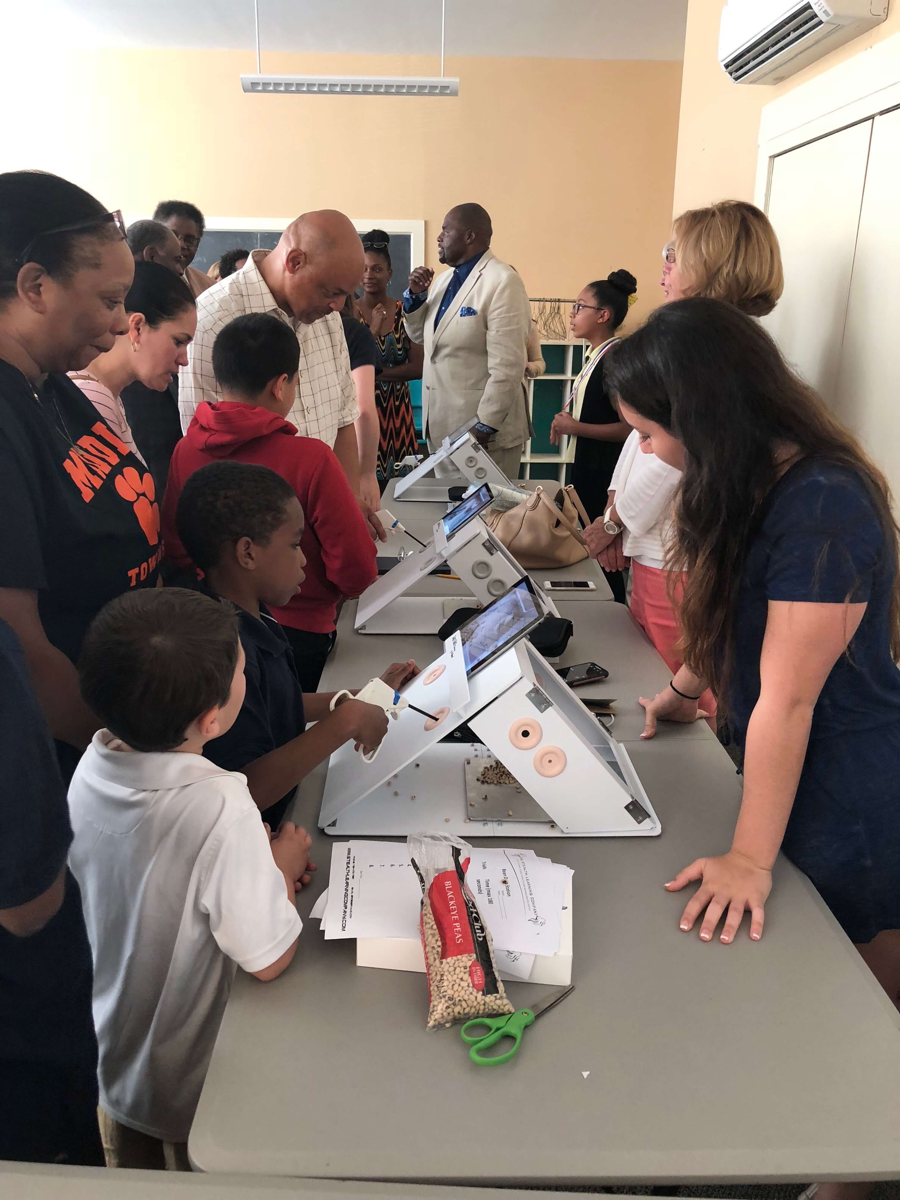 Middle Township School District students and parents test surgery simulators at the Stealth Learning Initiative award ceremony.