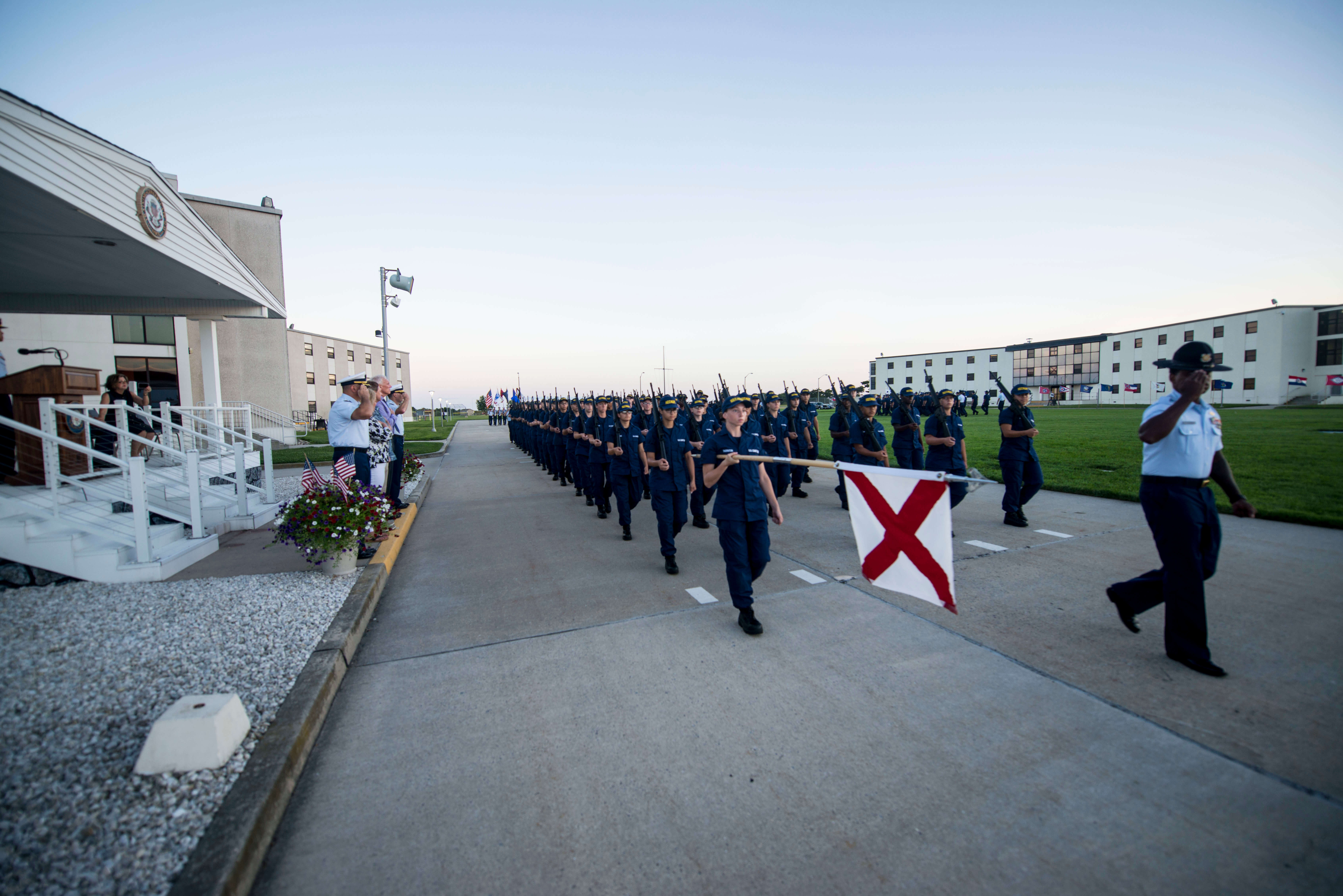Coast Guard Recruits march onto Training Center Cape May's Parade Field during a Sunset Parade Aug. 4