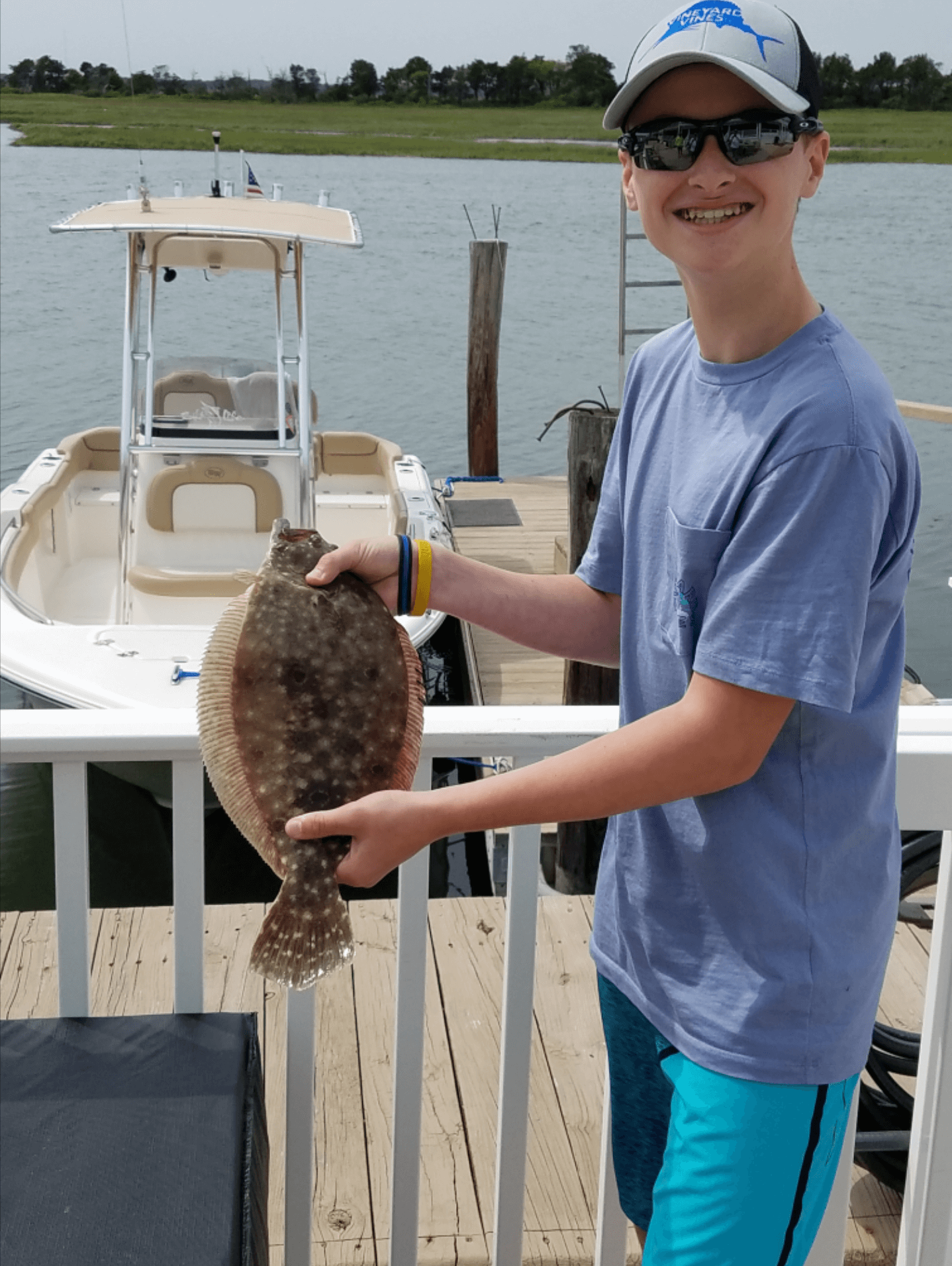 Michael Higgins and his first flounder of the season.