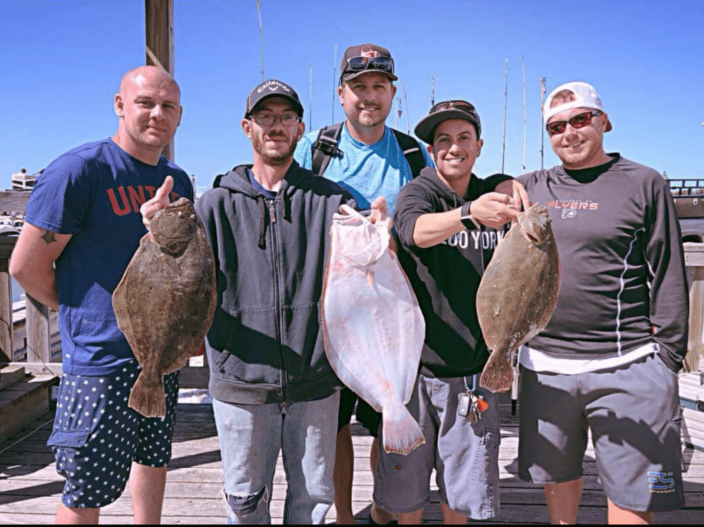 Happy fluke fisherman with their haul.