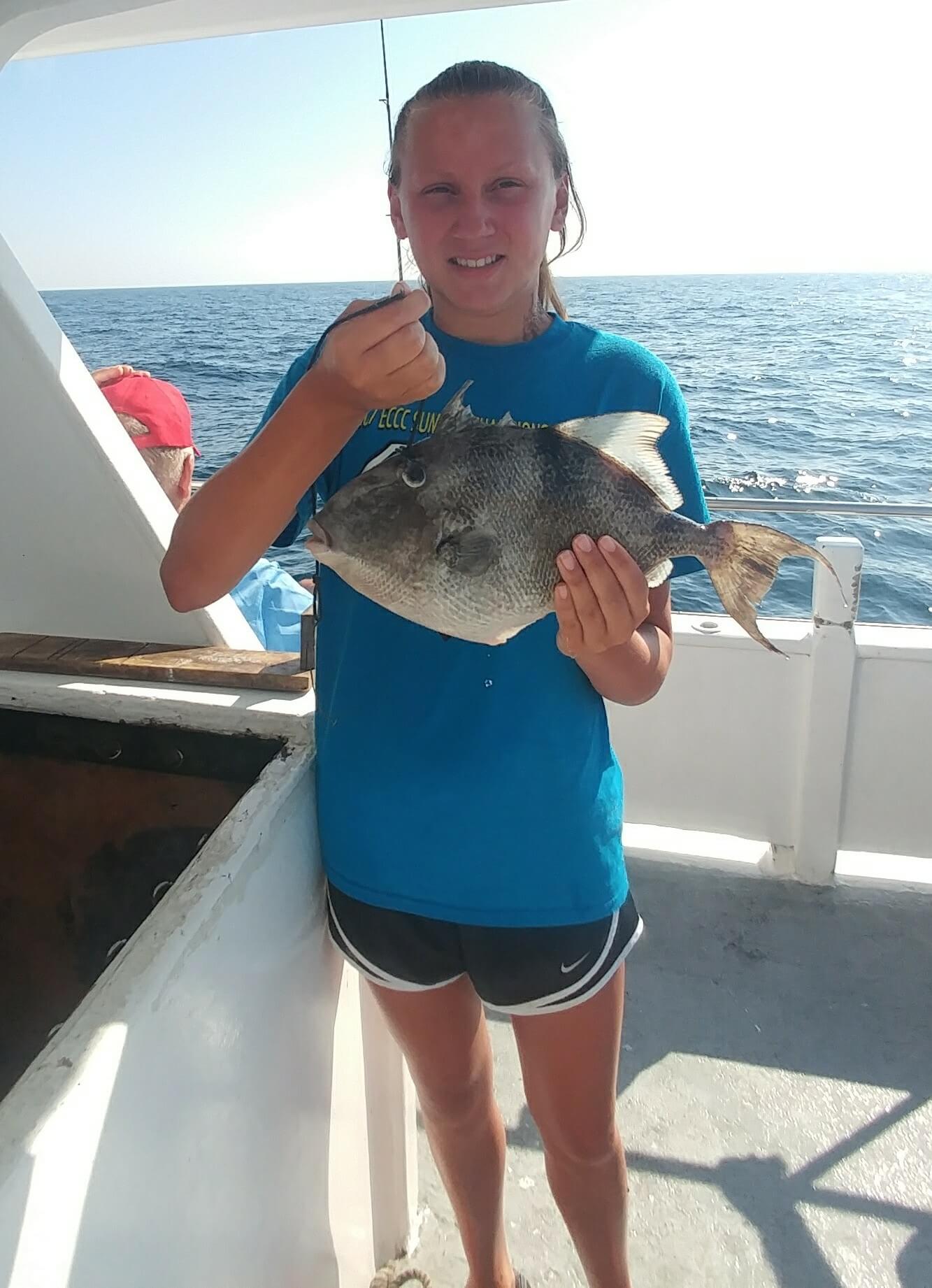 Lindsay Robbins and her pool-winning triggerfish.