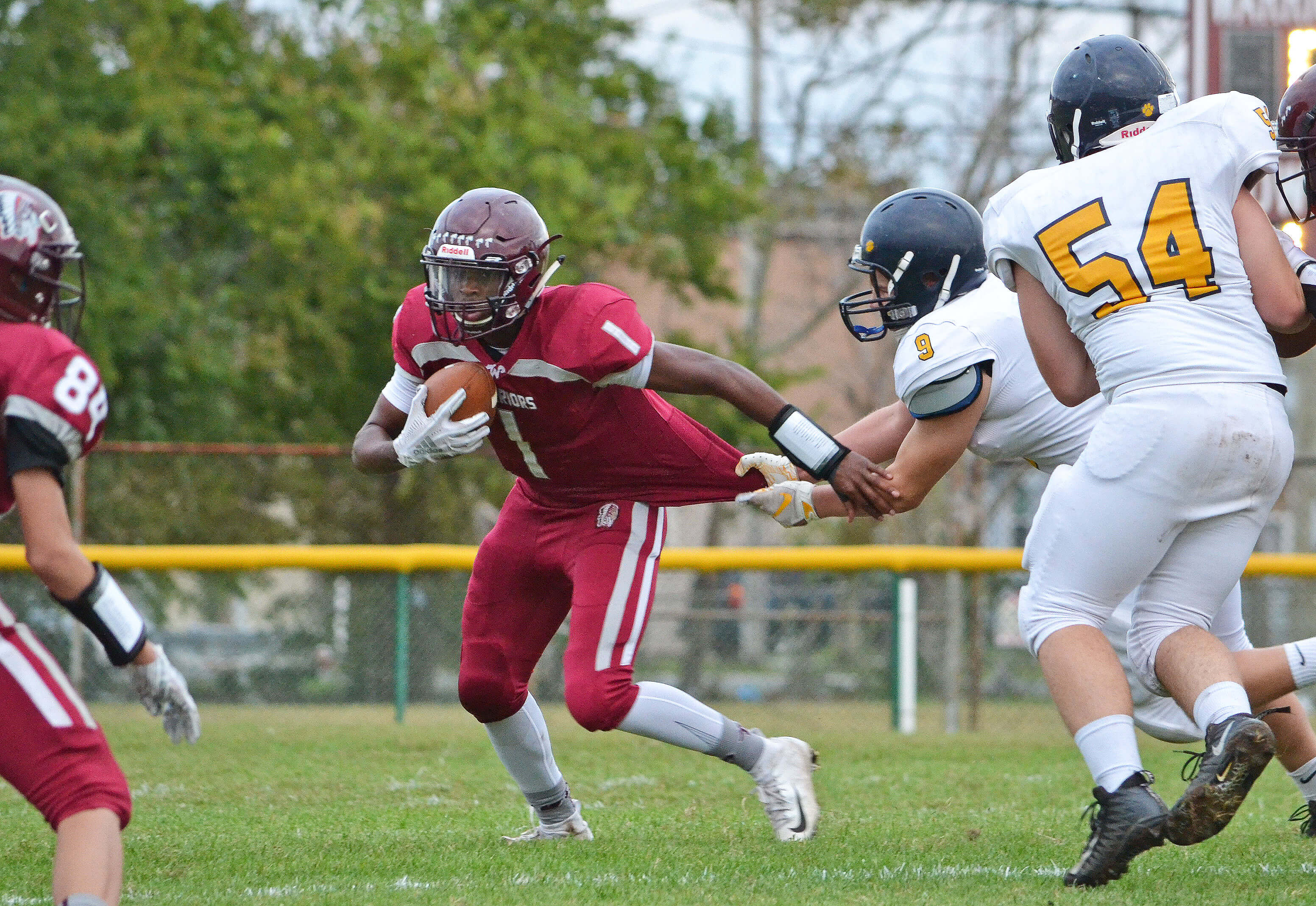 Wildwood quarterback Greg Mitchell breaks away from a Gloucester City defender in the Warriors' game on Sept. 28.