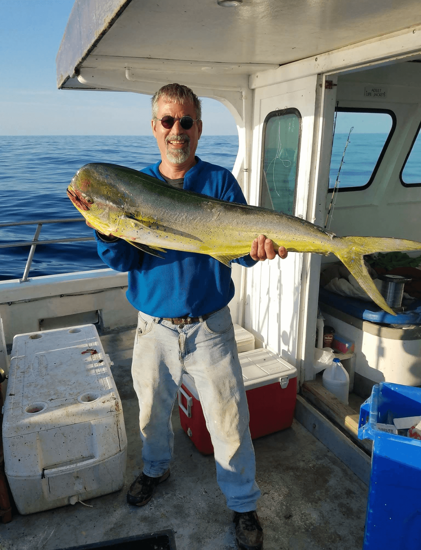 A happy angler with his mahi.