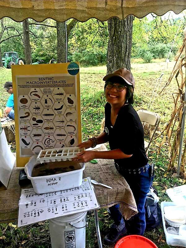 Cape May County Watershed Ambassador Kristen Andrada teaches people about macro-invertebrates using live bugs that were later returned to the water stream.