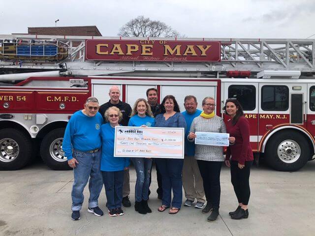 Paddle Out check presented to Lt. Andy Boyt Memorial Fund.