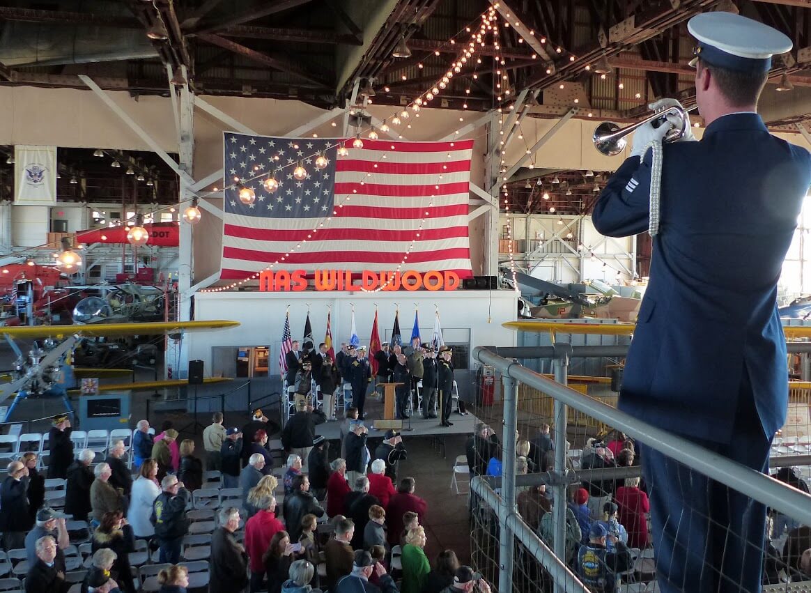 Coast Guard musician plays "Taps" to conclude Cape May County's Veterans Day ceremony at Naval Air Station Wildwood