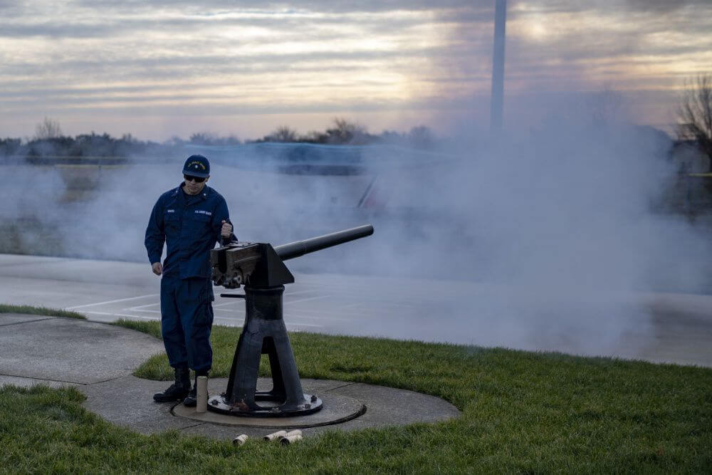 Petty Officers Kirby Graves and Austin Rucker honor the passing of President George H. W. Bush