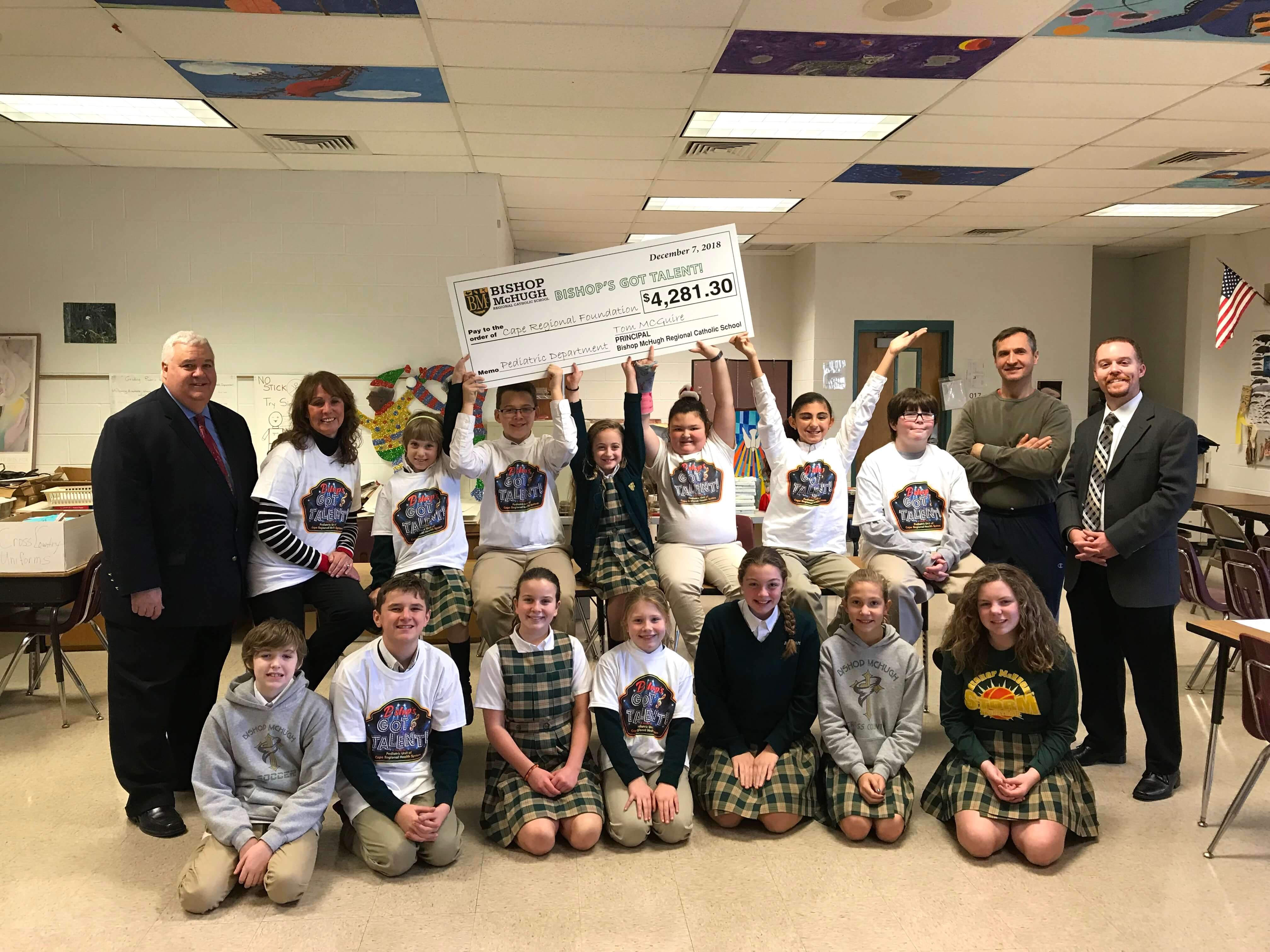 BMRS Principal Tom McGuire (far right) and Building and Grounds Supervisor Andrew Majewski are pictured here with the CARES Leadership Team and Thomas J. Piratzky