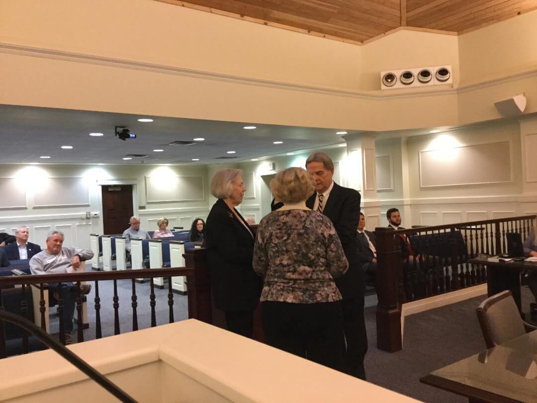 Raymond Parzych takes the oath of office from Borough Clerk Suzanne Stanford accompanied by his wife Bernadette.J