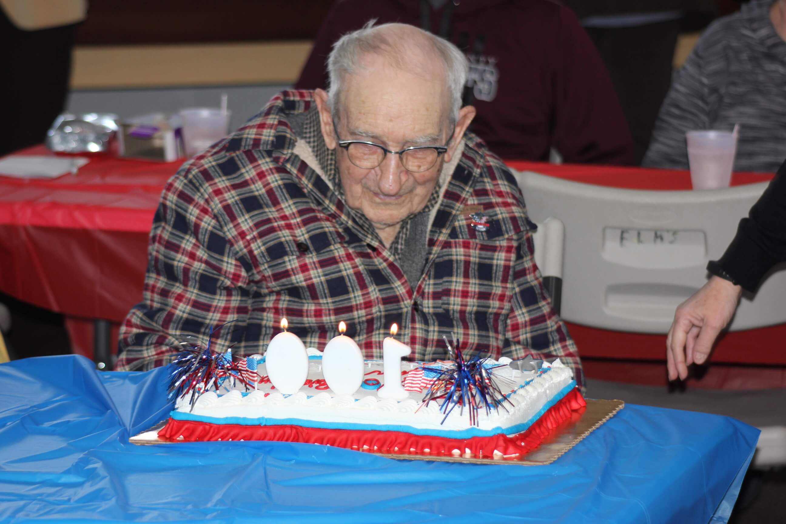 100-year-old World War II Army veteran James Neill prepares to blow out the candles on his birthday cake during a party held at the Greater Cape May Elks Lodge 2839 in Villas. Neill served in the Army Corps of Engineers in the Philippine Islands.