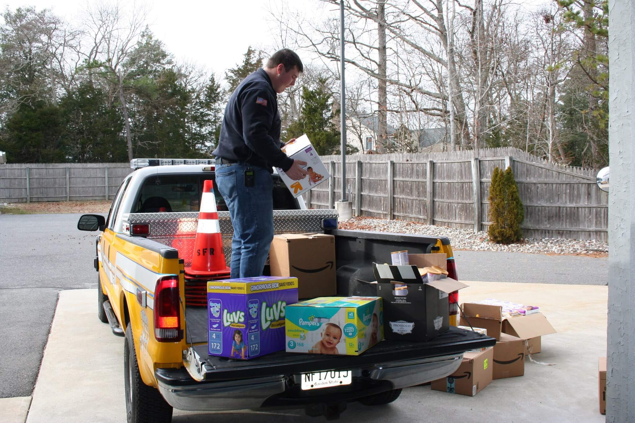 Kevin O'Brien organizes donated items being collected by the Seaville Fire Department and American Legion Post 184