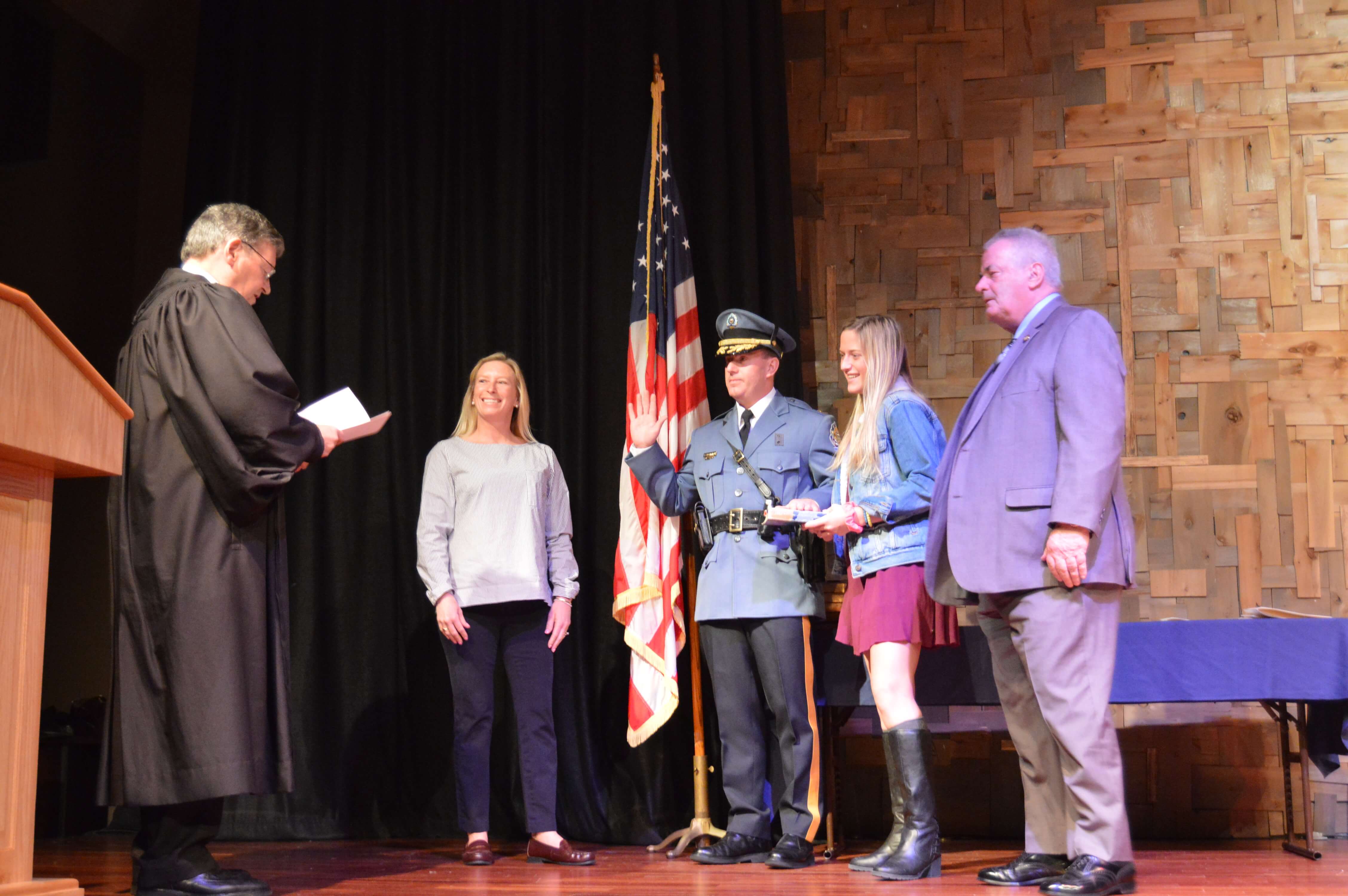 ​Ocean City Police Chief John Jay Prettyman takes his oath of office from Judge Richard Russell Feb. 13 with his wife Tiffany at his side and daughter Chloe holding the Bible. The chief's father John Prettyman watches at right.