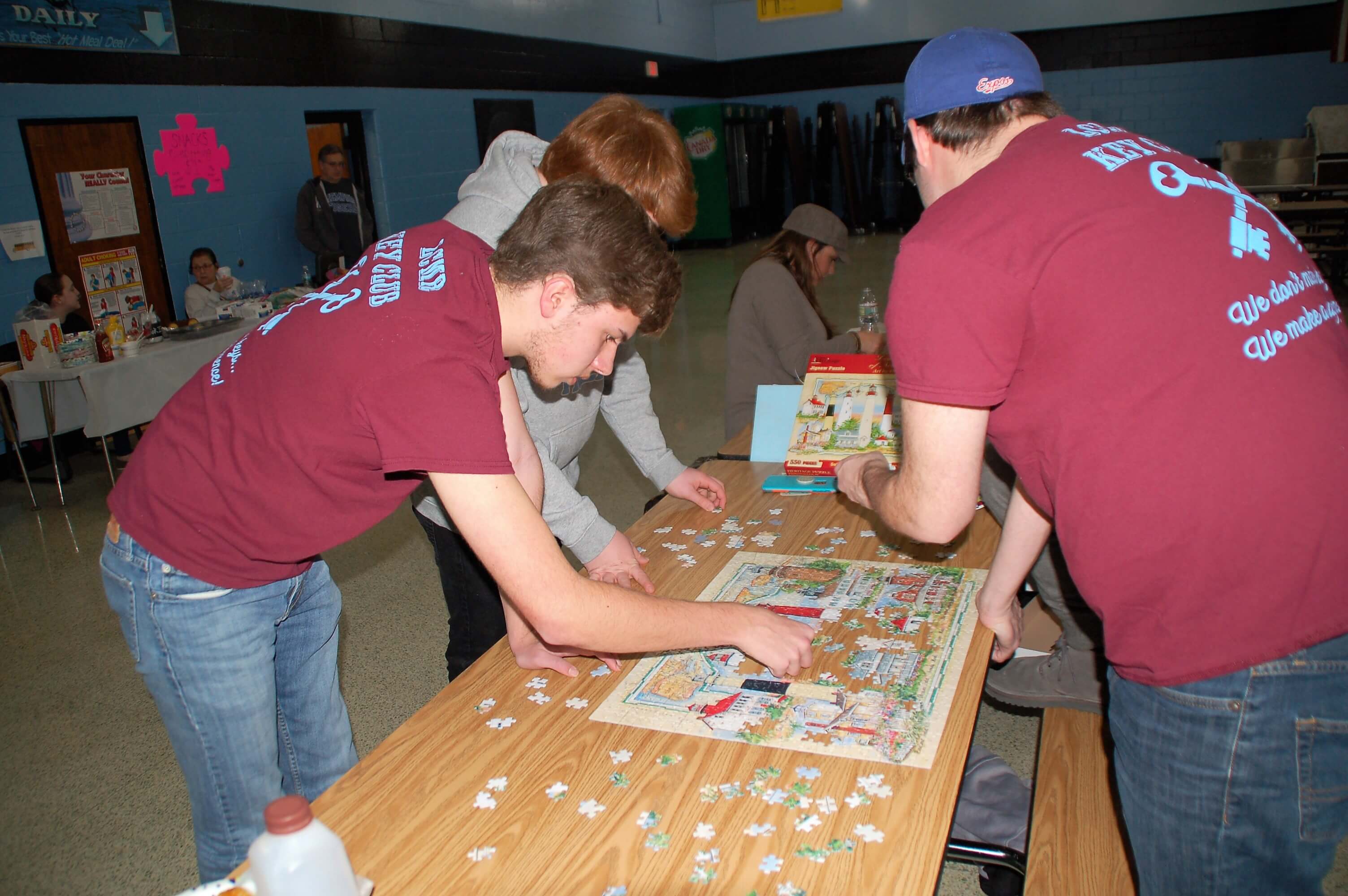 Puzzlers piece the shapes during the first jigsaw puzzle tournament at Richard M. Teitelman School.