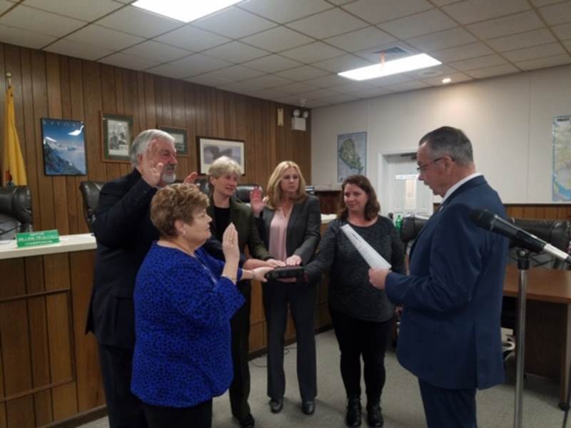 Taking oaths from Assemblyman John Armato (D-2nd) are