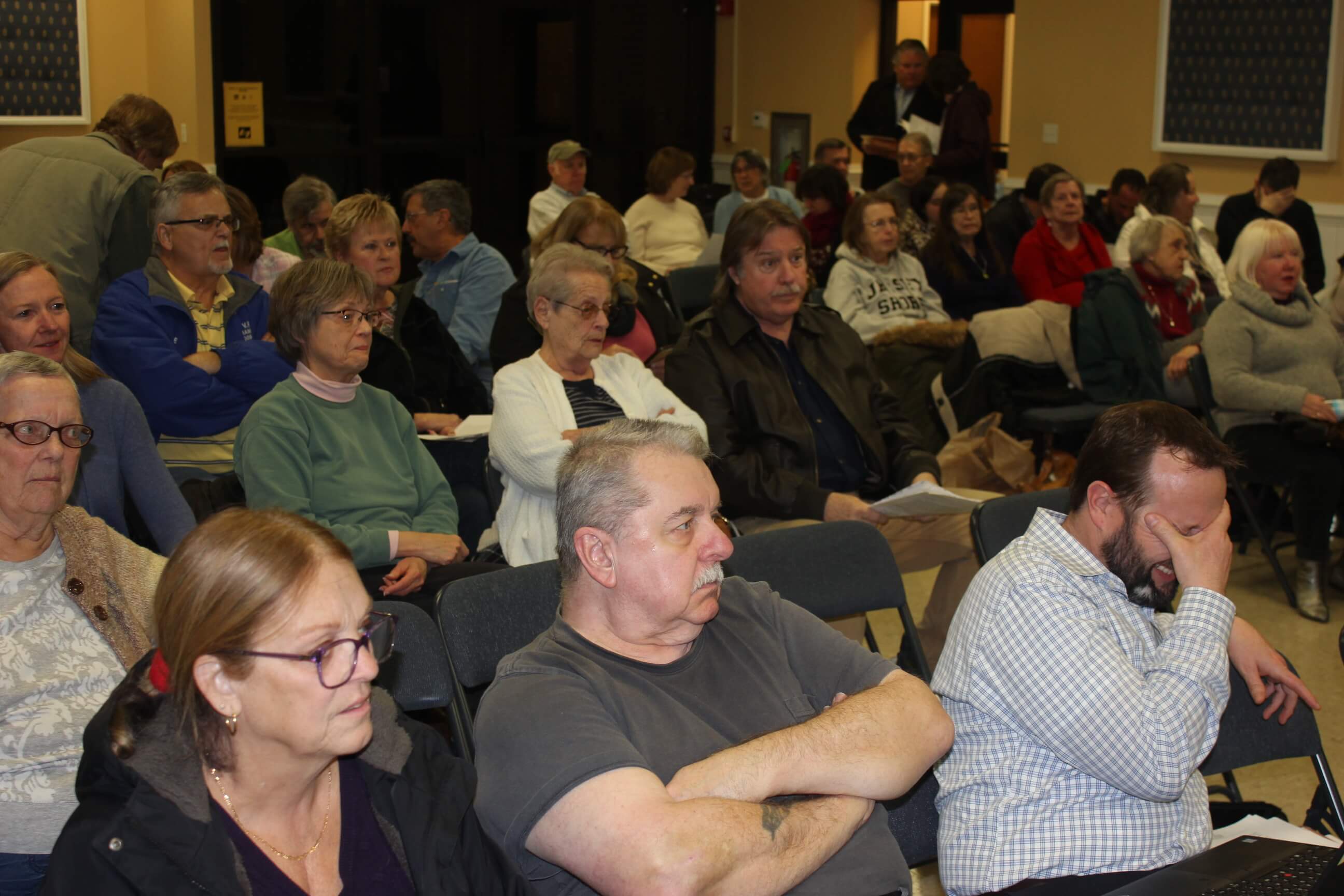 A full house turned out for the continuation and public comment of a use-variance application to build 21 homes in a dual-zoned